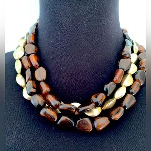 Short necklace with brown and gold beads